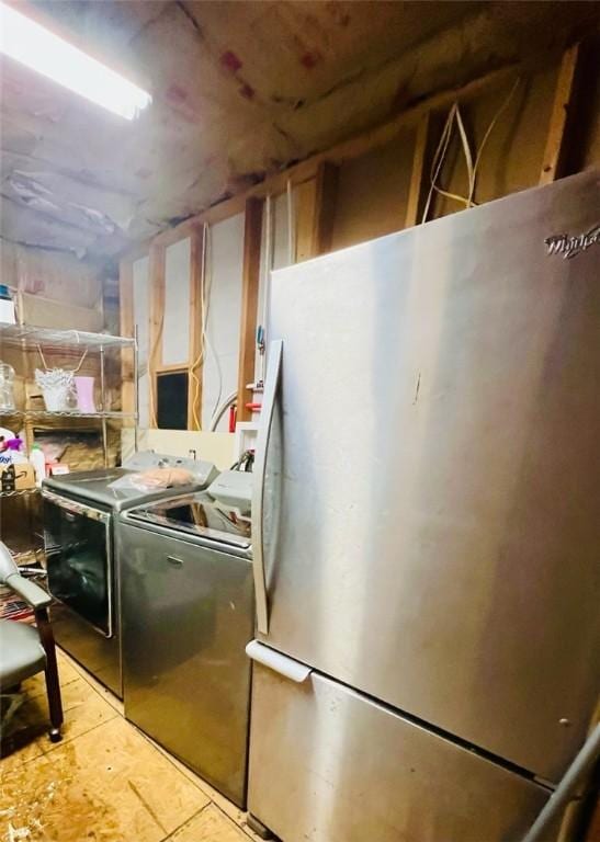 14163 Low Gap Wc 100 Rd, West Fork, AR 72774 - unfinished basement with freestanding refrigerator and independent washer and dryer