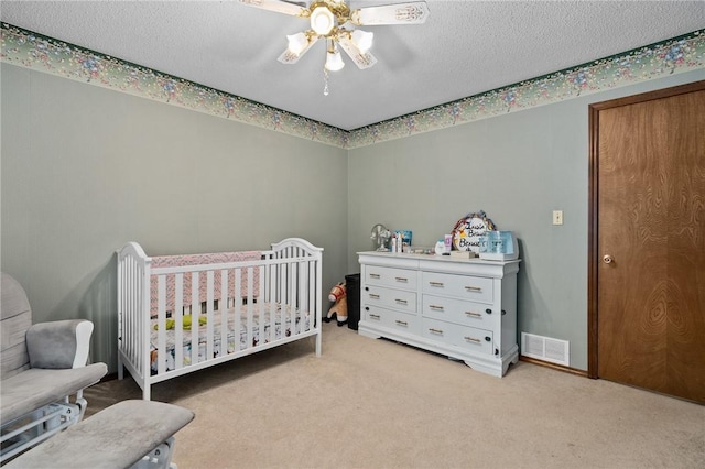 319 Belle Ave, Alma, AR 72921 - bedroom with carpet flooring, a crib, and a ceiling fan
