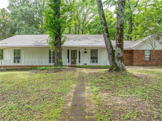 319 Belle Ave, Alma, AR 72921 - ranch-style home featuring covered porch, brick siding, a chimney, board and batten siding, and roof with shingles