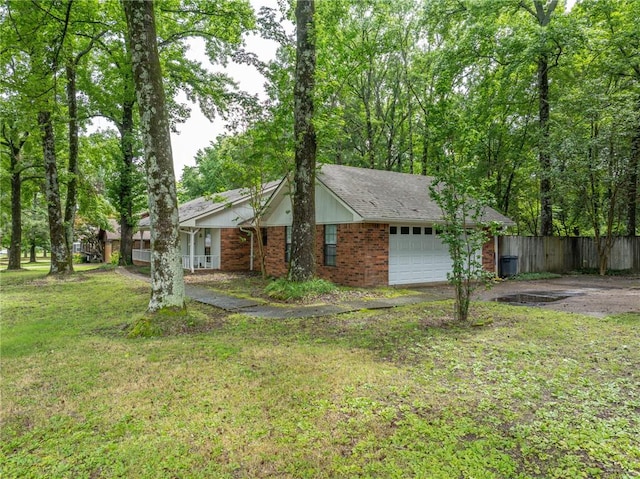 319 Belle Ave, Alma, AR 72921 - view of front of home featuring brick siding and a garage