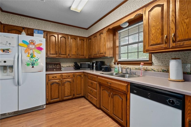 319 Belle Ave, Alma, AR 72921 - kitchen with white appliances, ornamental molding, light wood finished floors, a textured ceiling, and brown cabinetry