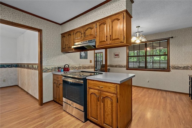319 Belle Ave, Alma, AR 72921 - kitchen with electric stove, wallpapered walls, under cabinet range hood, light wood-style floors, and brown cabinetry