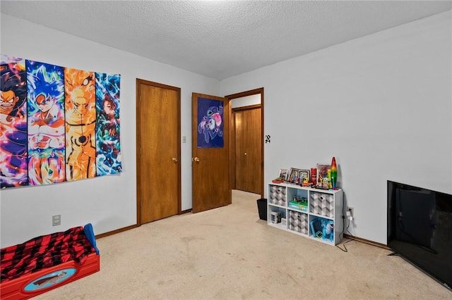 319 Belle Ave, Alma, AR 72921 - game room with carpet floors and a textured ceiling