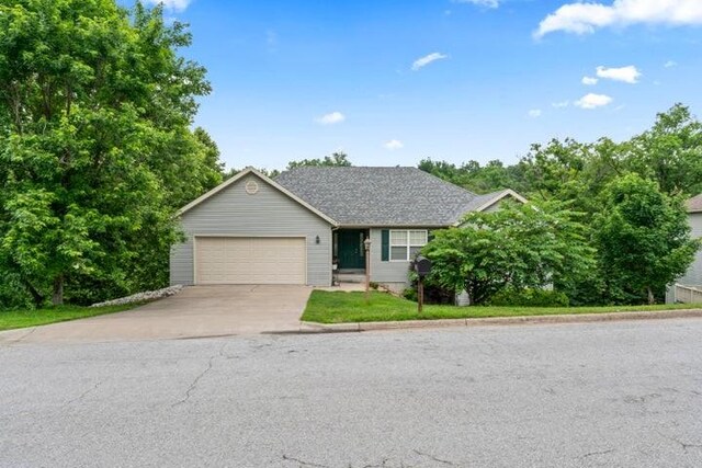 150 Cedar Wood Ave, Branson, MO 65616 - ranch-style house featuring driveway and a garage