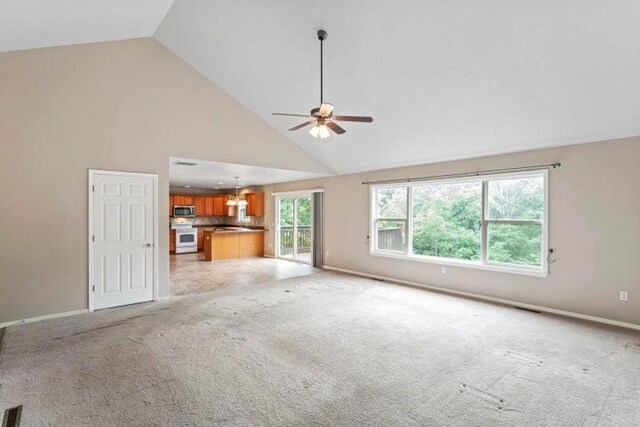 150 Cedar Wood Ave, Branson, MO 65616 - unfurnished living room featuring ceiling fan, high vaulted ceiling, and light carpet