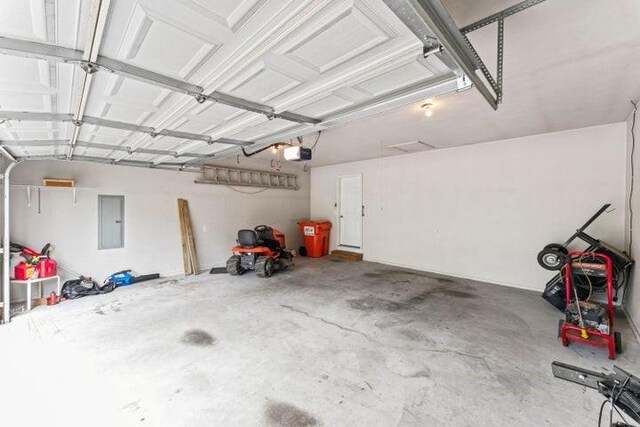 150 Cedar Wood Ave, Branson, MO 65616 - garage featuring a garage door opener and electric panel