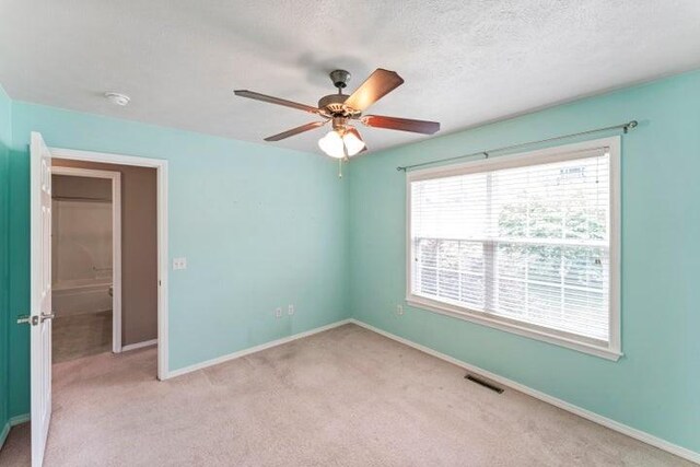 150 Cedar Wood Ave, Branson, MO 65616 - unfurnished room with light carpet, a ceiling fan, and a textured ceiling