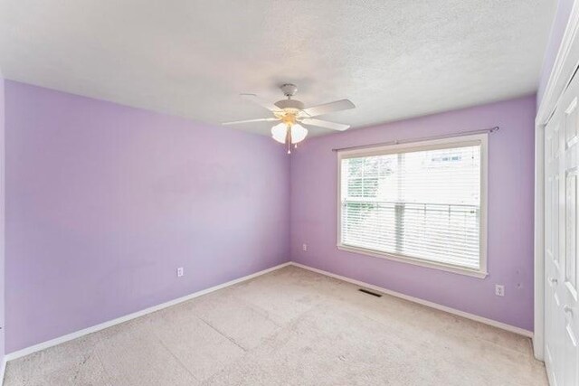 150 Cedar Wood Ave, Branson, MO 65616 - spare room with light carpet and a ceiling fan