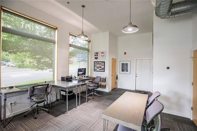 3901 W 5th St, Fayetteville, AR 72701 - home office featuring dark carpet and baseboards
