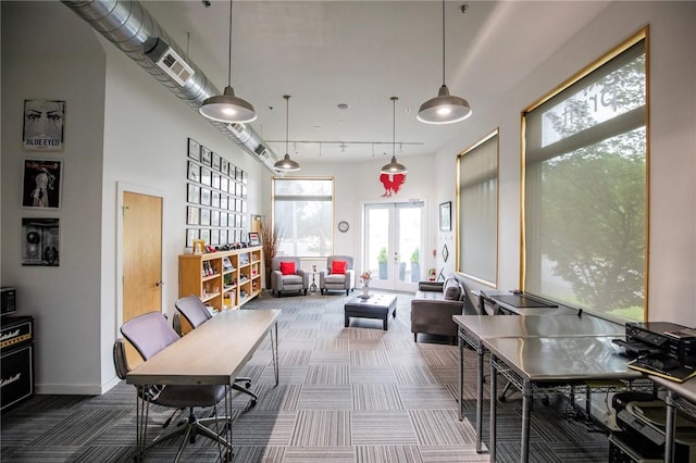 3901 W 5th St, Fayetteville, AR 72701 - dining space with carpet flooring, french doors, and rail lighting