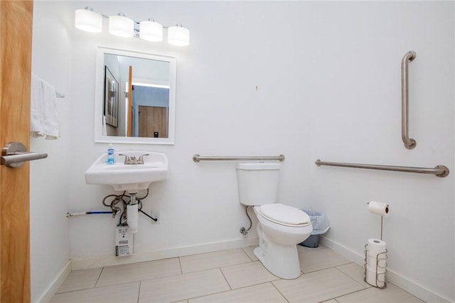 3901 W 5th St, Fayetteville, AR 72701 - bathroom featuring toilet and tile patterned floors