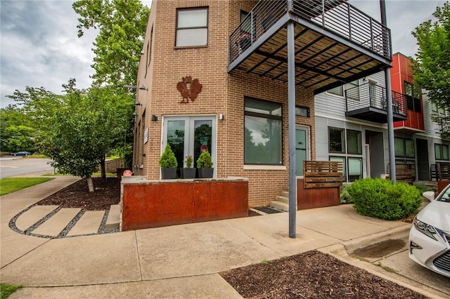 3901 W 5th St, Fayetteville, AR 72701 - rear view of property featuring brick siding