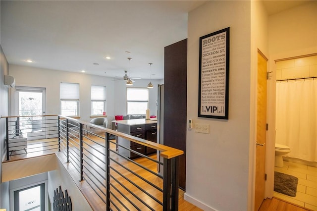 3901 W 5th St, Fayetteville, AR 72701 - hall featuring an upstairs landing, wood finished floors, and recessed lighting