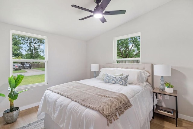 802 Hinshaw Dr, Springdale, AR 72762 - bedroom with multiple windows, vaulted ceiling, wood finished floors, and ceiling fan