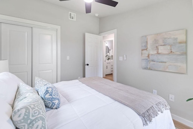 802 Hinshaw Dr, Springdale, AR 72762 - bedroom with a closet, ceiling fan, and wood finished floors