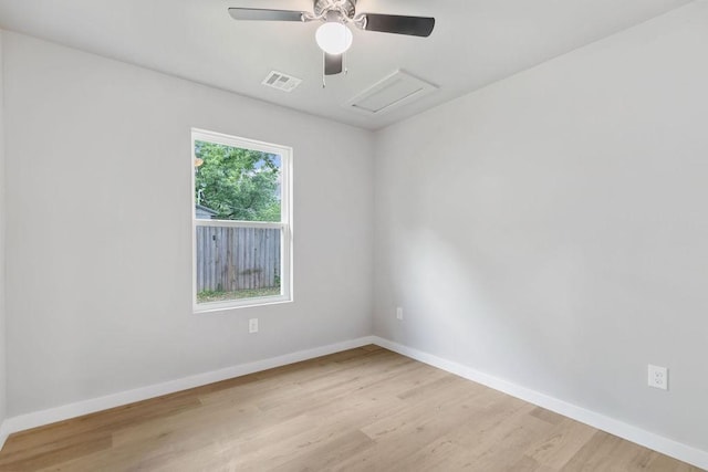 802 Hinshaw Dr, Springdale, AR 72762 - unfurnished room featuring wood finished floors, attic access, and ceiling fan