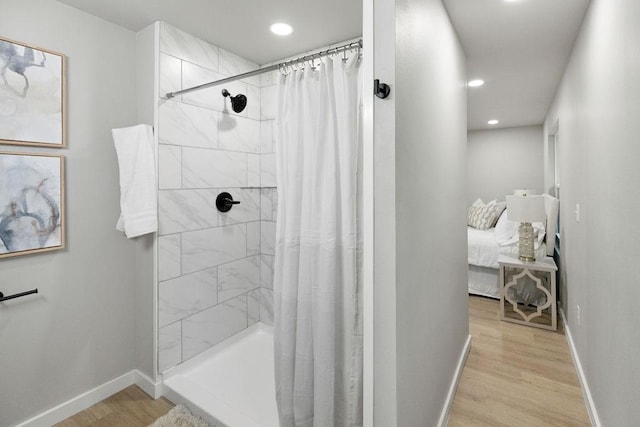802 Hinshaw Dr, Springdale, AR 72762 - ensuite bathroom featuring wood finished floors, recessed lighting, and tiled shower