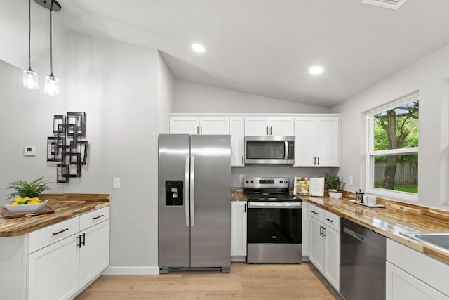 802 Hinshaw Dr, Springdale, AR 72762 - kitchen with appliances with stainless steel finishes, lofted ceiling, light wood-style floors, white cabinetry, and wooden counters