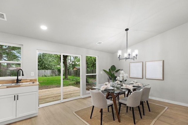 802 Hinshaw Dr, Springdale, AR 72762 - dining room featuring light wood-style floors, lofted ceiling, and a chandelier