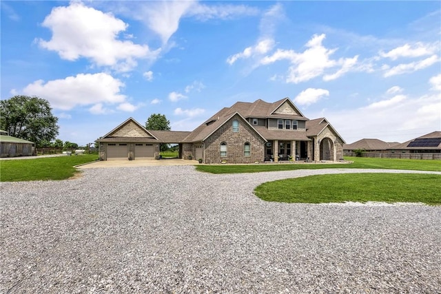 11267 Walters Rd, Bentonville, AR 72712 - view of front of house featuring curved driveway, an attached garage, and brick siding