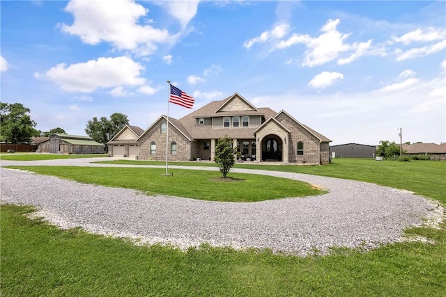 11267 Walters Rd, Bentonville, AR 72712 - view of front of property featuring curved driveway, a front lawn, and a garage