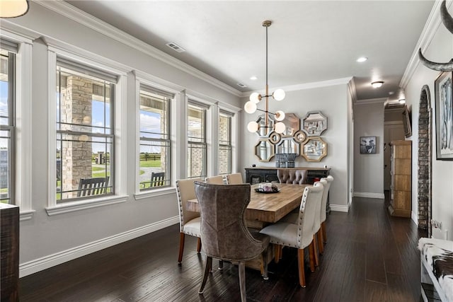 11267 Walters Rd, Bentonville, AR 72712 - dining space featuring plenty of natural light, dark wood-style flooring, a chandelier, recessed lighting, and ornamental molding