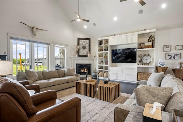 11267 Walters Rd, Bentonville, AR 72712 - living room with ceiling fan, a glass covered fireplace, high vaulted ceiling, dark wood-style flooring, and recessed lighting