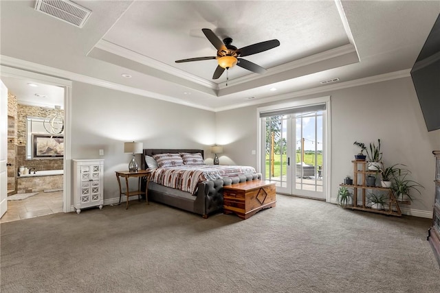 11267 Walters Rd, Bentonville, AR 72712 - carpeted bedroom with access to exterior, a raised ceiling, ornamental molding, connected bathroom, and ceiling fan
