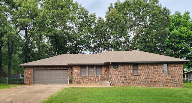 1805 Van Buren Ave, Mountain Home, AR 72653 - view of front facade featuring an attached garage, driveway, a front lawn, brick siding, and crawl space