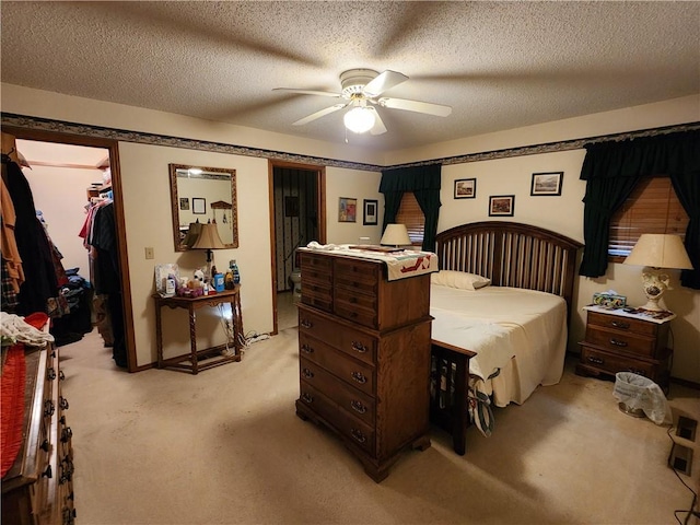 1805 Van Buren Ave, Mountain Home, AR 72653 - bedroom with light carpet, a walk in closet, a closet, and a ceiling fan