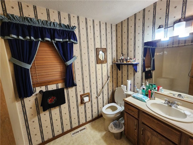 1805 Van Buren Ave, Mountain Home, AR 72653 - bathroom with wallpapered walls, vanity, a textured ceiling, and a shower