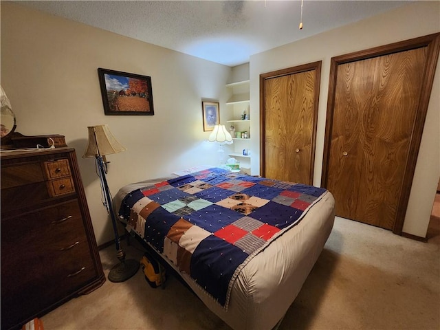1805 Van Buren Ave, Mountain Home, AR 72653 - bedroom featuring light carpet and multiple closets