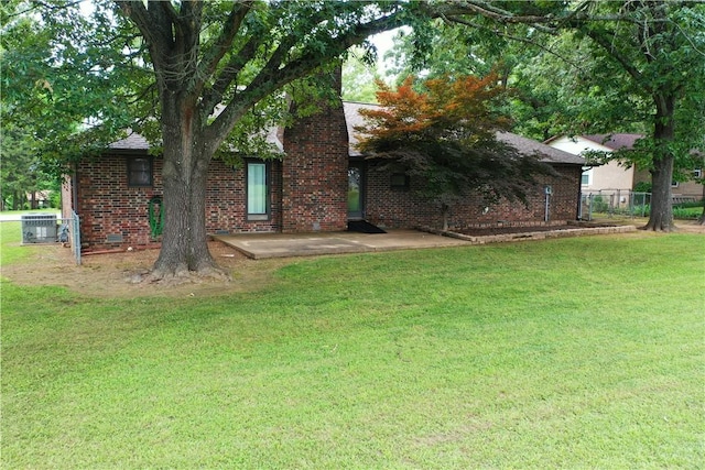 1805 Van Buren Ave, Mountain Home, AR 72653 - back of house featuring brick siding and a patio