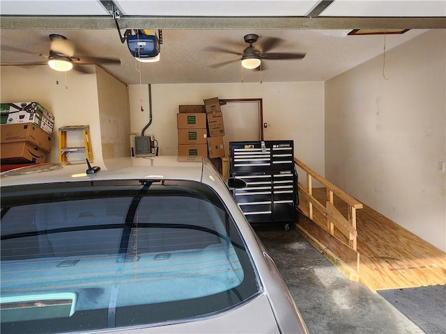 1805 Van Buren Ave, Mountain Home, AR 72653 - garage featuring a garage door opener, a ceiling fan, and electric panel