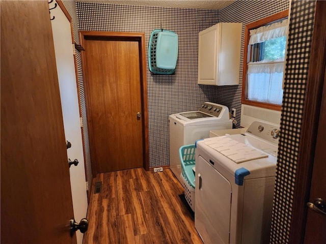1805 Van Buren Ave, Mountain Home, AR 72653 - laundry room featuring cabinet space, washer and dryer, and wood finished floors