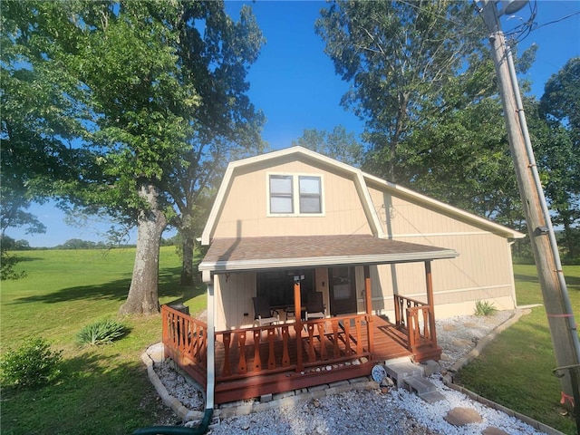 46 Hathcoat Rd, Harrison, AR 72601 - back of property featuring a lawn, a shingled roof, a gambrel roof, and a porch