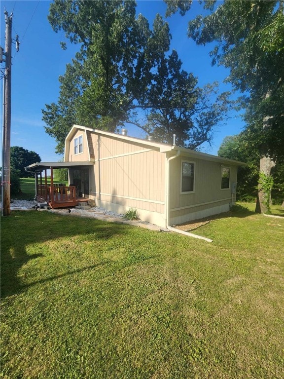 46 Hathcoat Rd, Harrison, AR 72601 - rear view of property with a wooden deck and a lawn