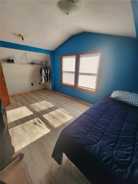 46 Hathcoat Rd, Harrison, AR 72601 - bedroom with lofted ceiling and wood finished floors