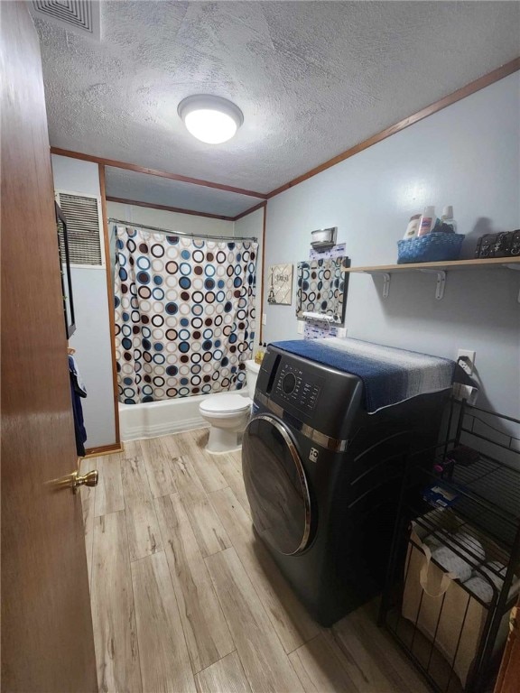46 Hathcoat Rd, Harrison, AR 72601 - washroom with washer / dryer, light wood finished floors, ornamental molding, and a textured ceiling
