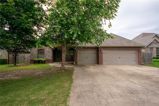 3402 Crosswinds Blvd, Bentonville, AR 72713 - view of front of house featuring an attached garage, brick siding, concrete driveway, and a shingled roof