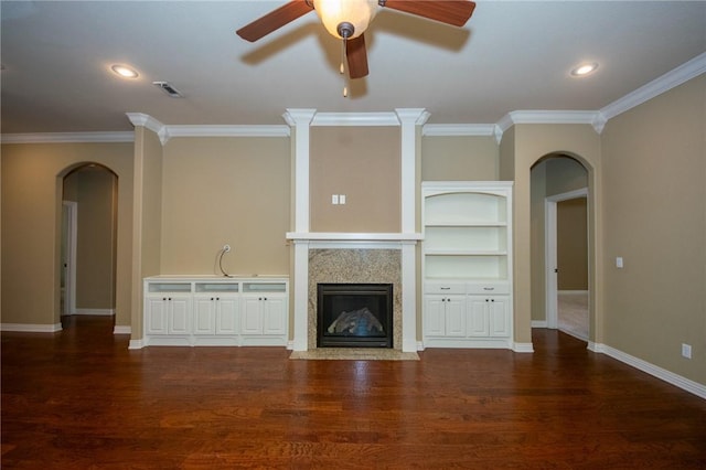 3402 Crosswinds Blvd, Bentonville, AR 72713 - unfurnished living room with arched walkways, a fireplace with flush hearth, ornamental molding, wood finished floors, and ceiling fan