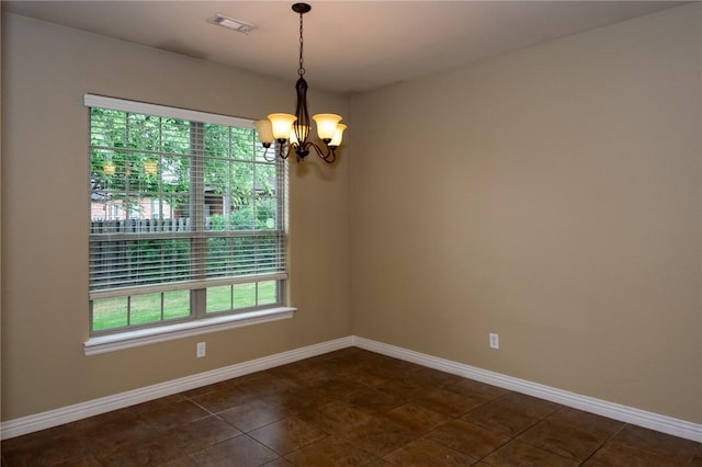 3402 Crosswinds Blvd, Bentonville, AR 72713 - unfurnished room with a chandelier and dark tile patterned floors