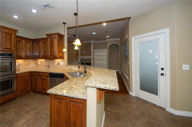 3402 Crosswinds Blvd, Bentonville, AR 72713 - kitchen featuring appliances with stainless steel finishes, a peninsula, ceiling fan, tasteful backsplash, and dark tile patterned floors