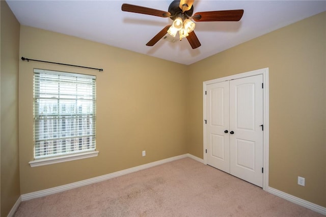 3402 Crosswinds Blvd, Bentonville, AR 72713 - unfurnished bedroom featuring light colored carpet, a closet, and ceiling fan