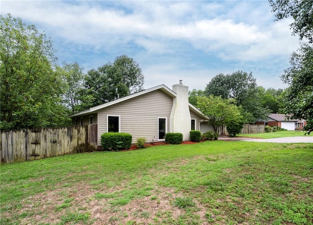 2176 Orchard Hill Rd, Siloam Springs, AR 72761 - view of property exterior featuring a chimney and driveway