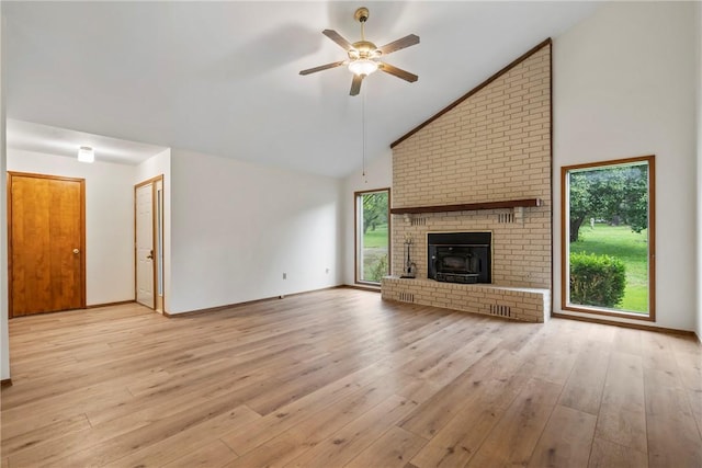 2176 Orchard Hill Rd, Siloam Springs, AR 72761 - unfurnished living room with ceiling fan, wood finished floors, high vaulted ceiling, and a fireplace
