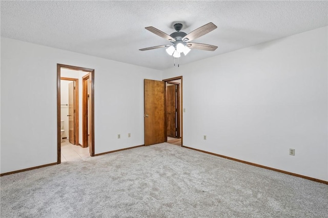 2176 Orchard Hill Rd, Siloam Springs, AR 72761 - unfurnished bedroom with light carpet, a textured ceiling, a ceiling fan, and ensuite bathroom