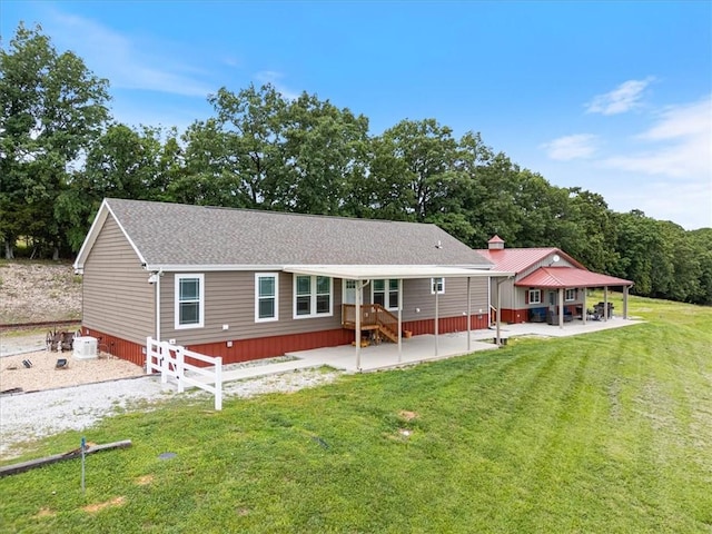 21018 Farm Rd Unit 2260, Eagle Rock, MO 65641 - back of property with a patio area, a lawn, roof with shingles, and a gazebo