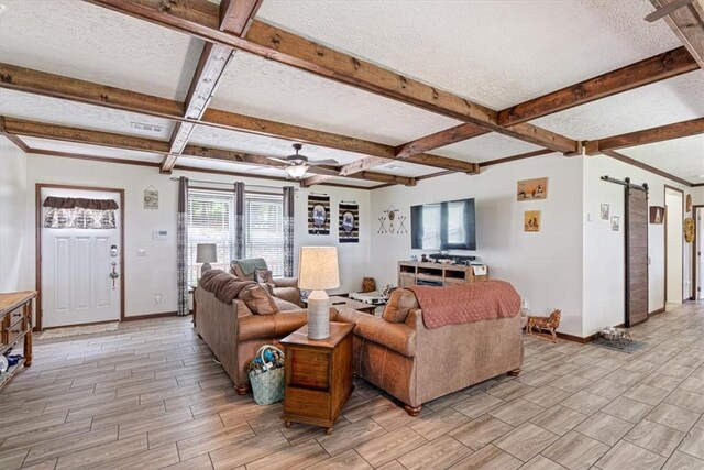 21018 Farm Rd Unit 2260, Eagle Rock, MO 65641 - living area featuring wood tiled floors, a textured ceiling, coffered ceiling, beam ceiling, and a barn door