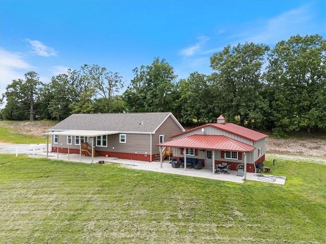 21018 Farm Rd Unit 2260, Eagle Rock, MO 65641 - rear view of property featuring entry steps, a patio area, a yard, and view of scattered trees